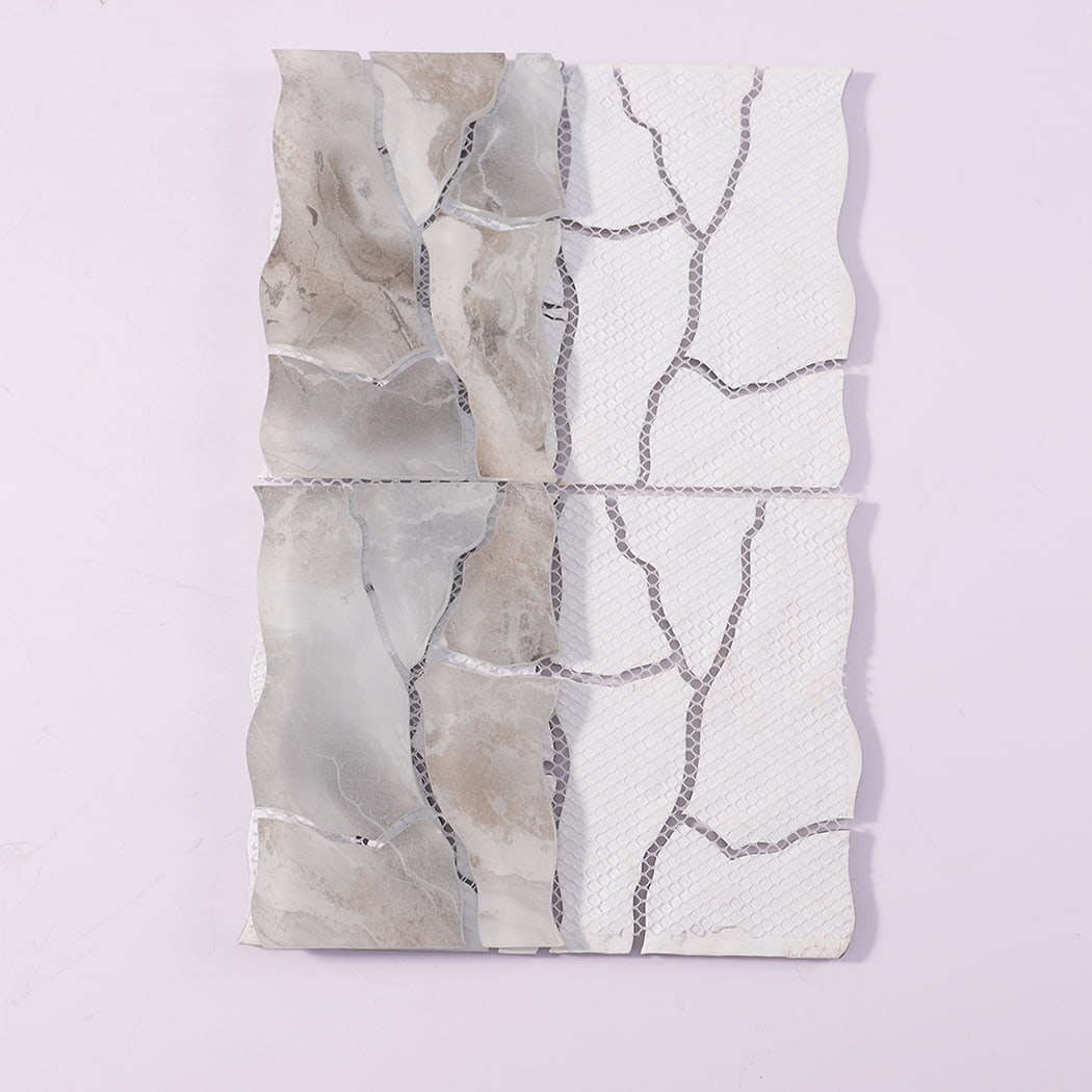 Back view of white gray irregular glass mosaic tile sheet with mesh backing