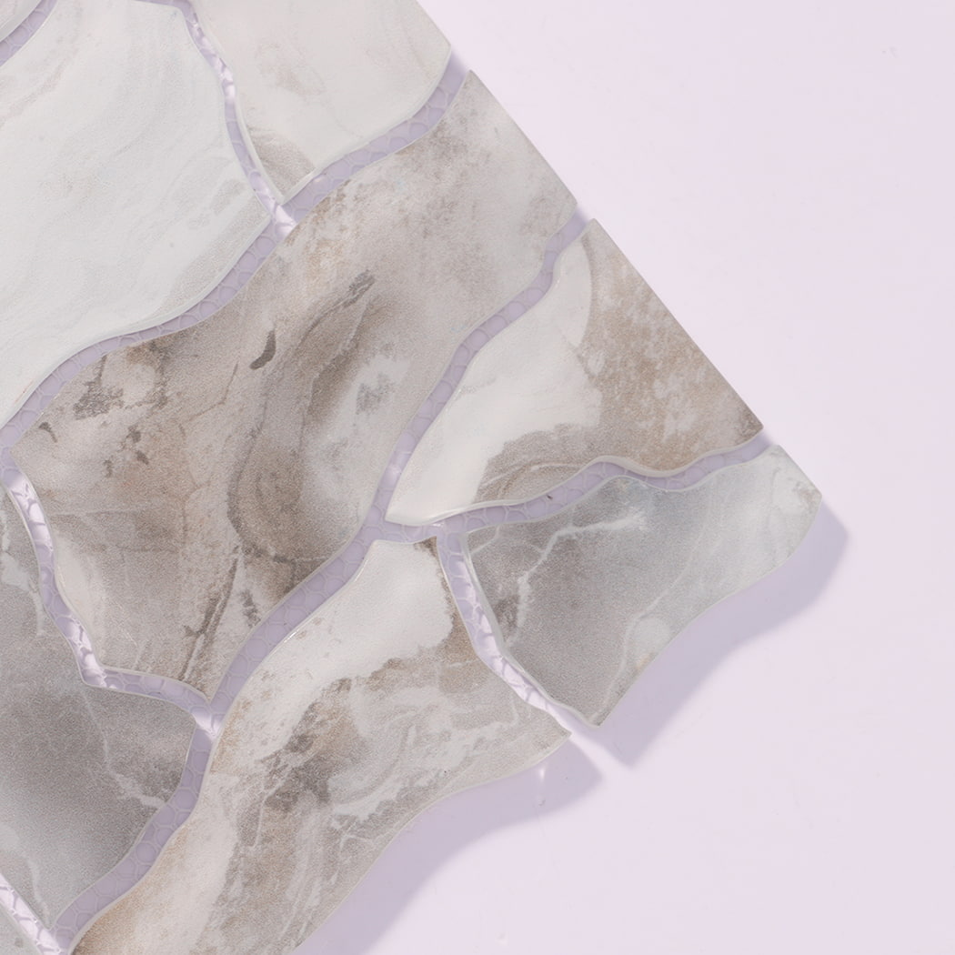 Close-up of white gray irregular glass mosaic tiles with cloudy veining