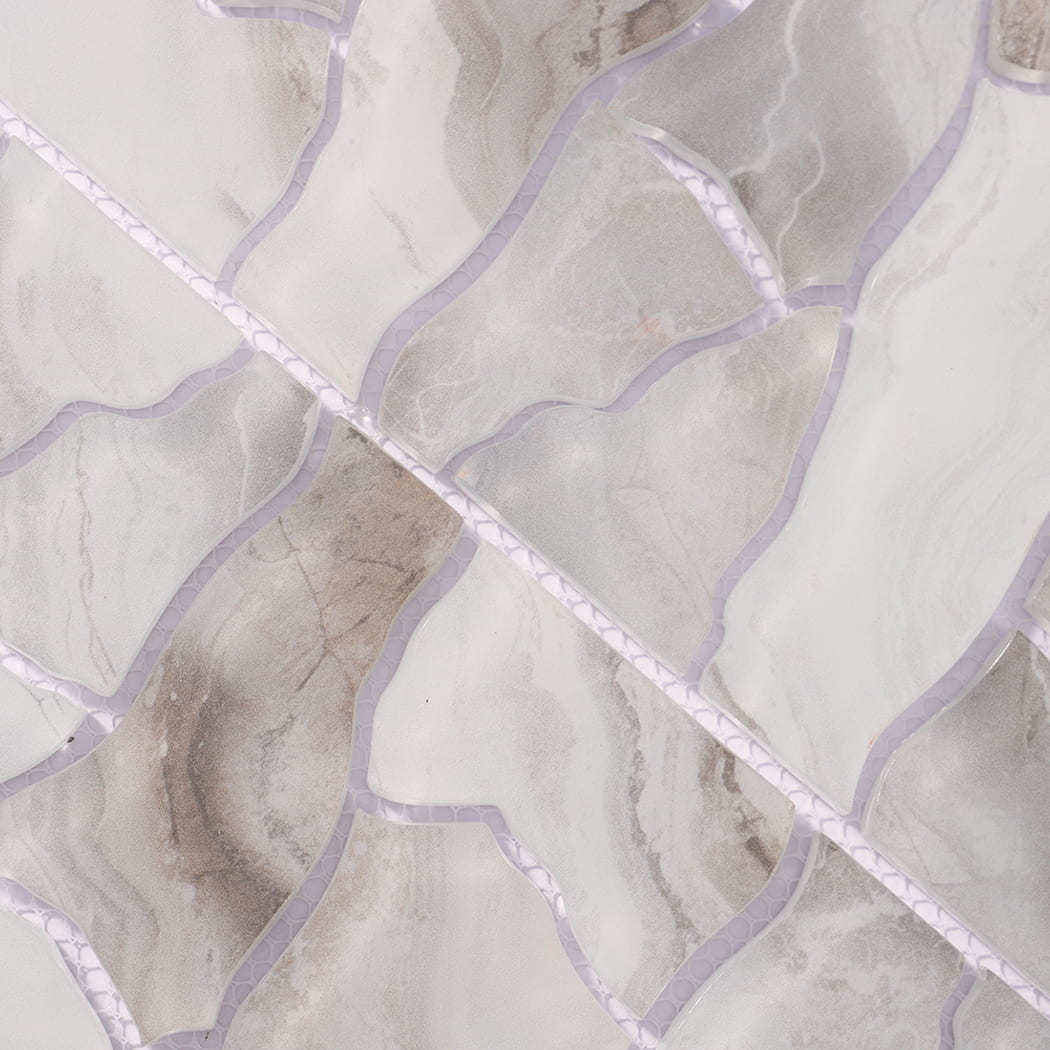 Detailed view of white gray irregular glass mosaic tiles on mesh backing