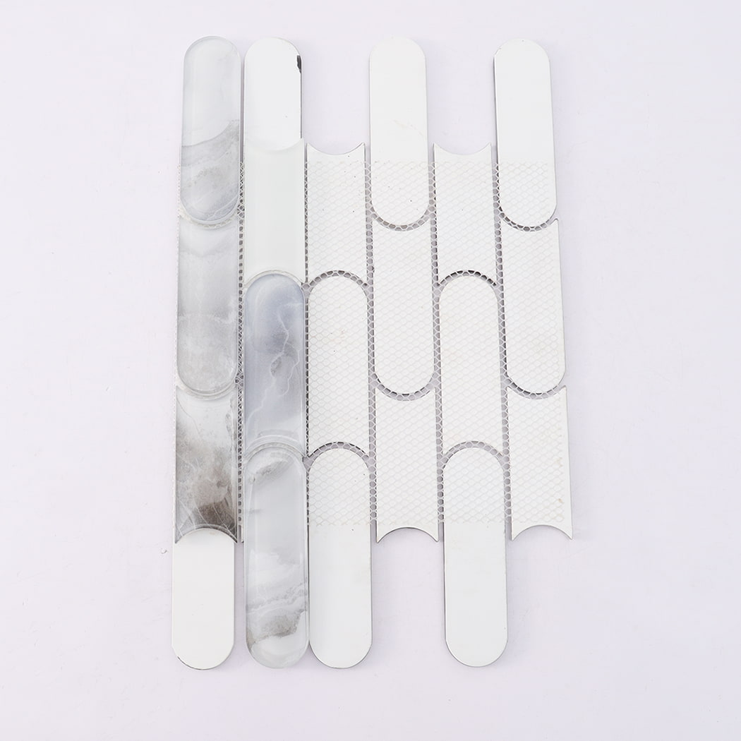 Back view of white gray pill shaped glass mosaic tile on mesh backing