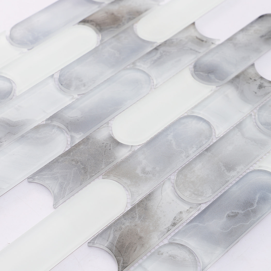 White gray pill shaped glass mosaic tile surface with cloudy flowing patterns