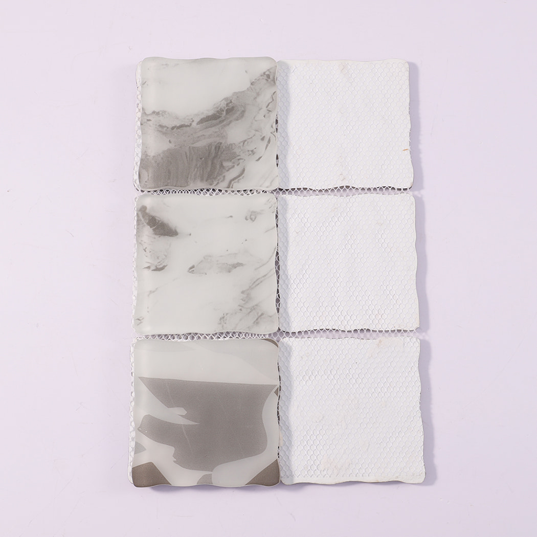 Back view of white gray wavy square glass mosaic tiles with mesh backing