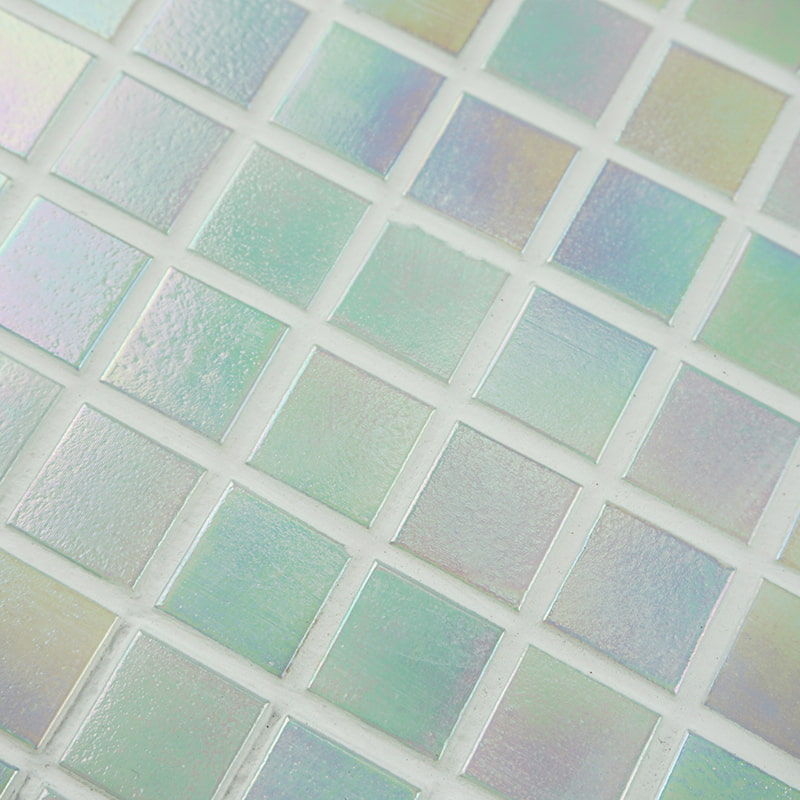White iridescent pool tiles with a reflective surface, perfect for water features.