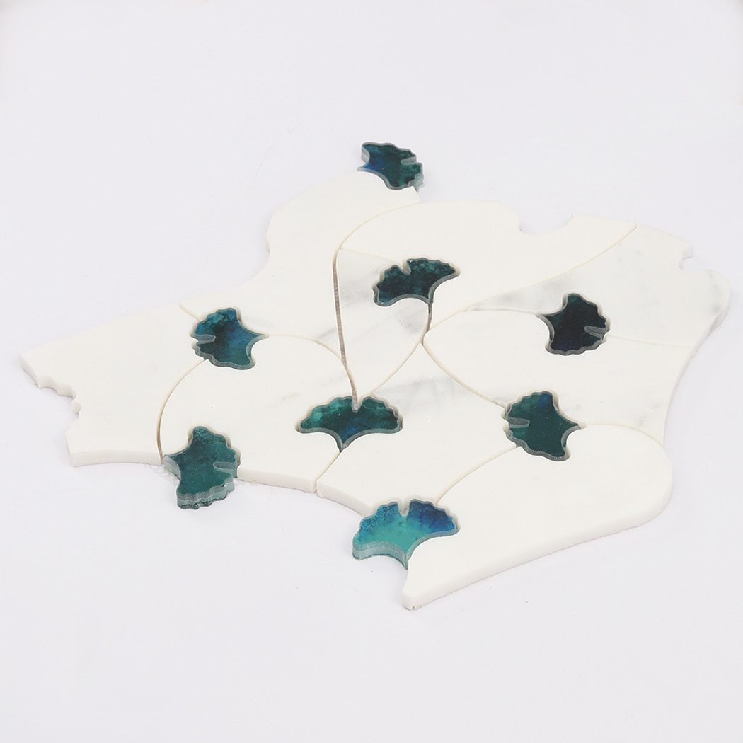 Repeating layout of white marble and teal glass waterjet floral mosaic tiles