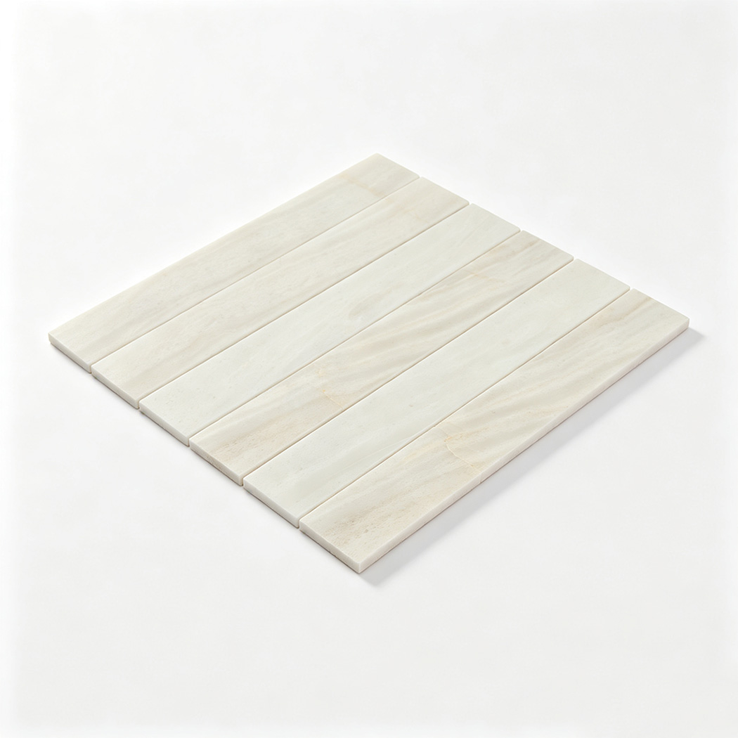 Angled full sheet view of white marble linear mosaic tile