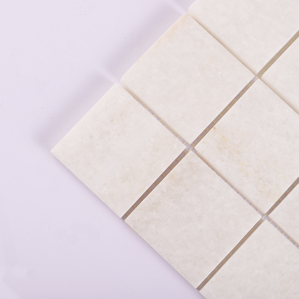 Close up showing white marble mosaic texture and surface details