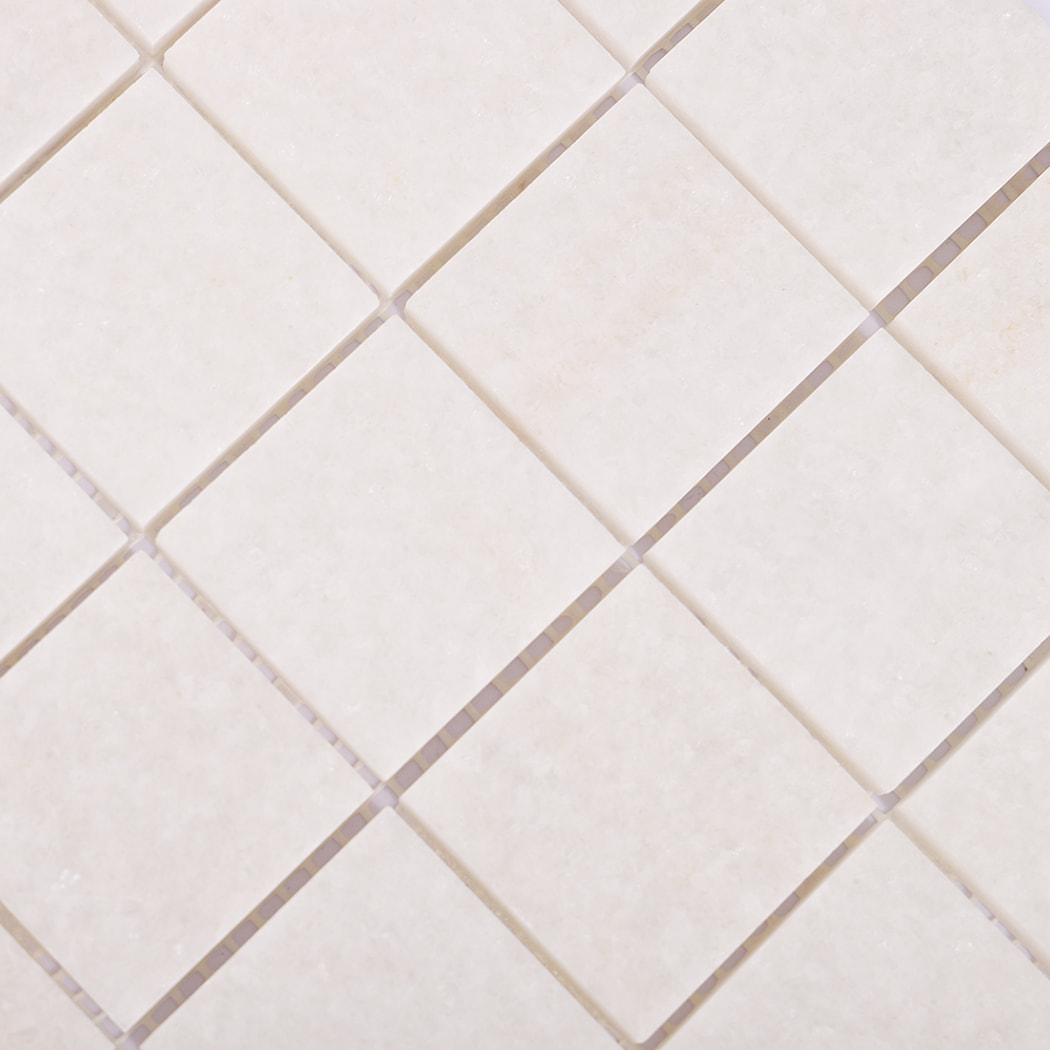 Detailed pattern of square white marble mosaic tiles