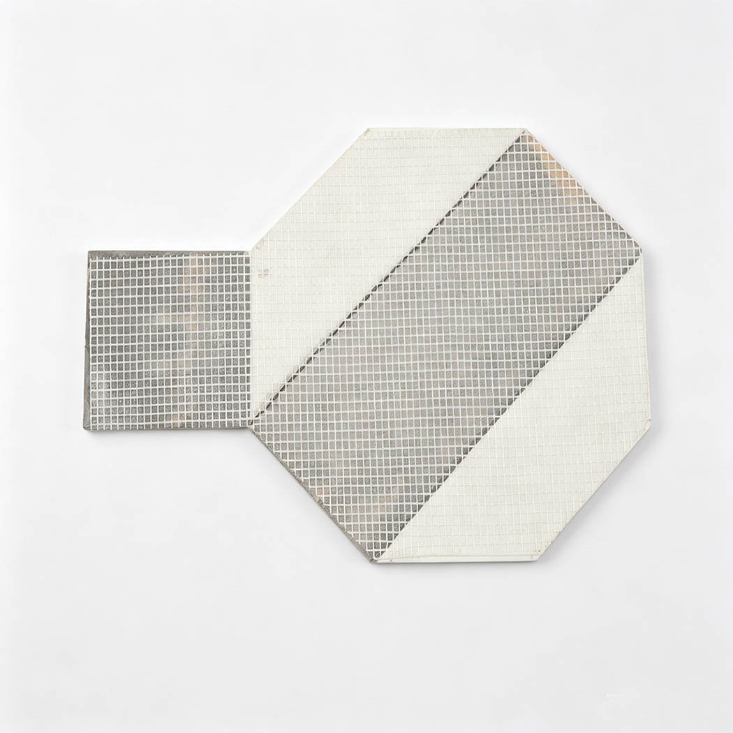 Mesh backing of white and brown marble geometric mosaic tile pieces