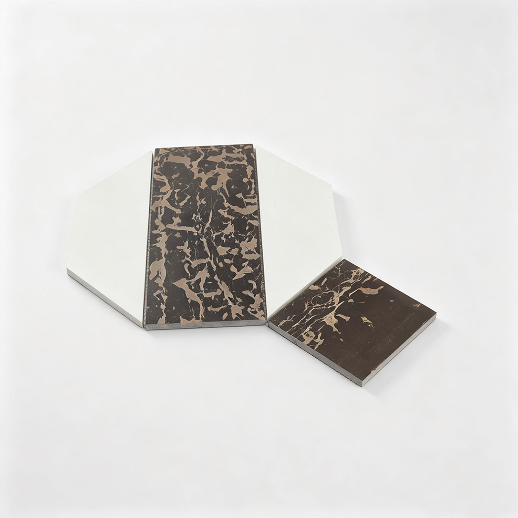 White and brown marble geometric mosaic tile sample with bold diagonal design