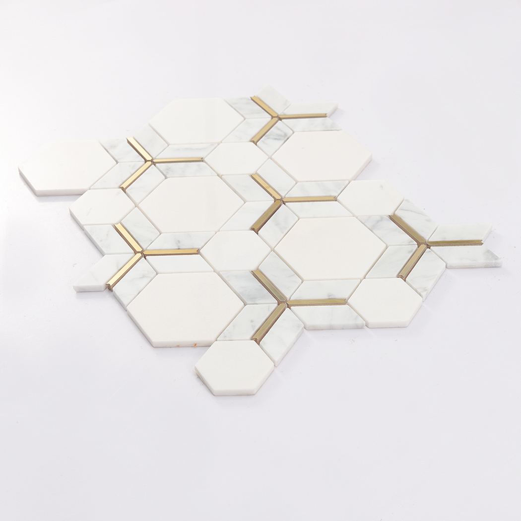 Angled display of white hexagon marble mosaic tile with gold line accents