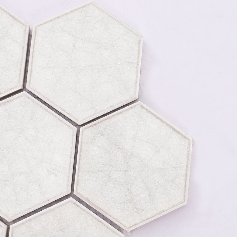 Corner close up of white hexagon mosaic tile