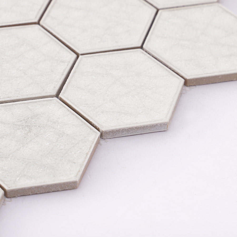 Edge detail of white hexagon mosaic tile sheet