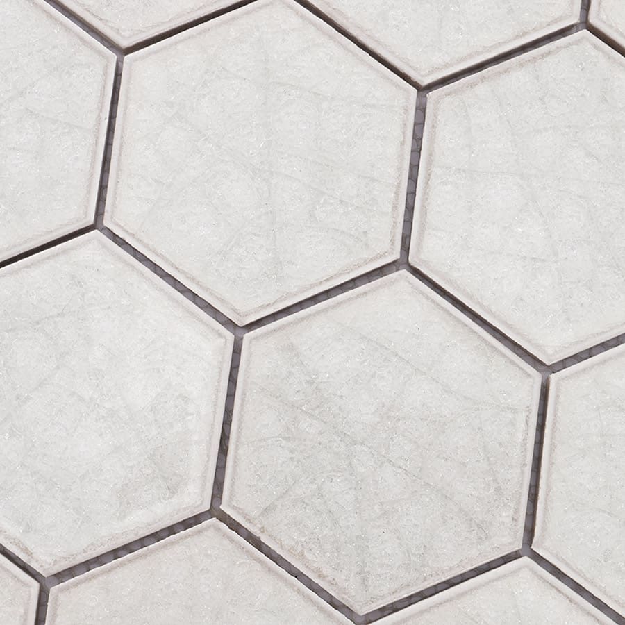 Surface detail of white hexagon mosaic tiles