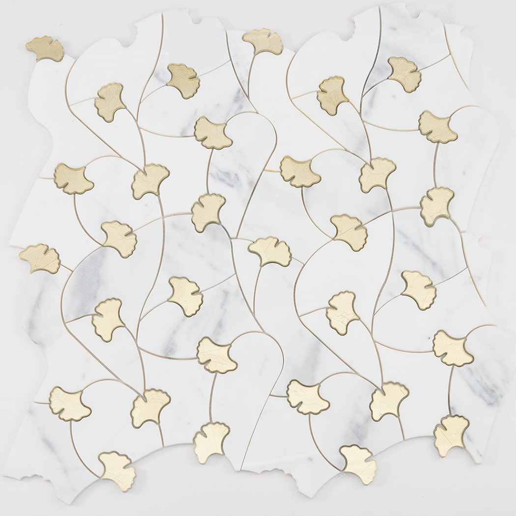 Partial layout of white marble and gold glass waterjet floral mosaic tile