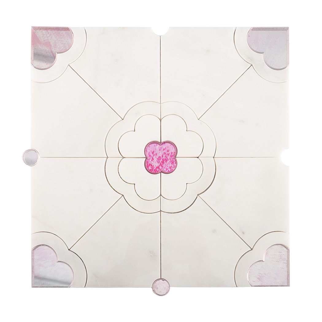 Front view of white marble waterjet tile featuring a pink quatrefoil design.