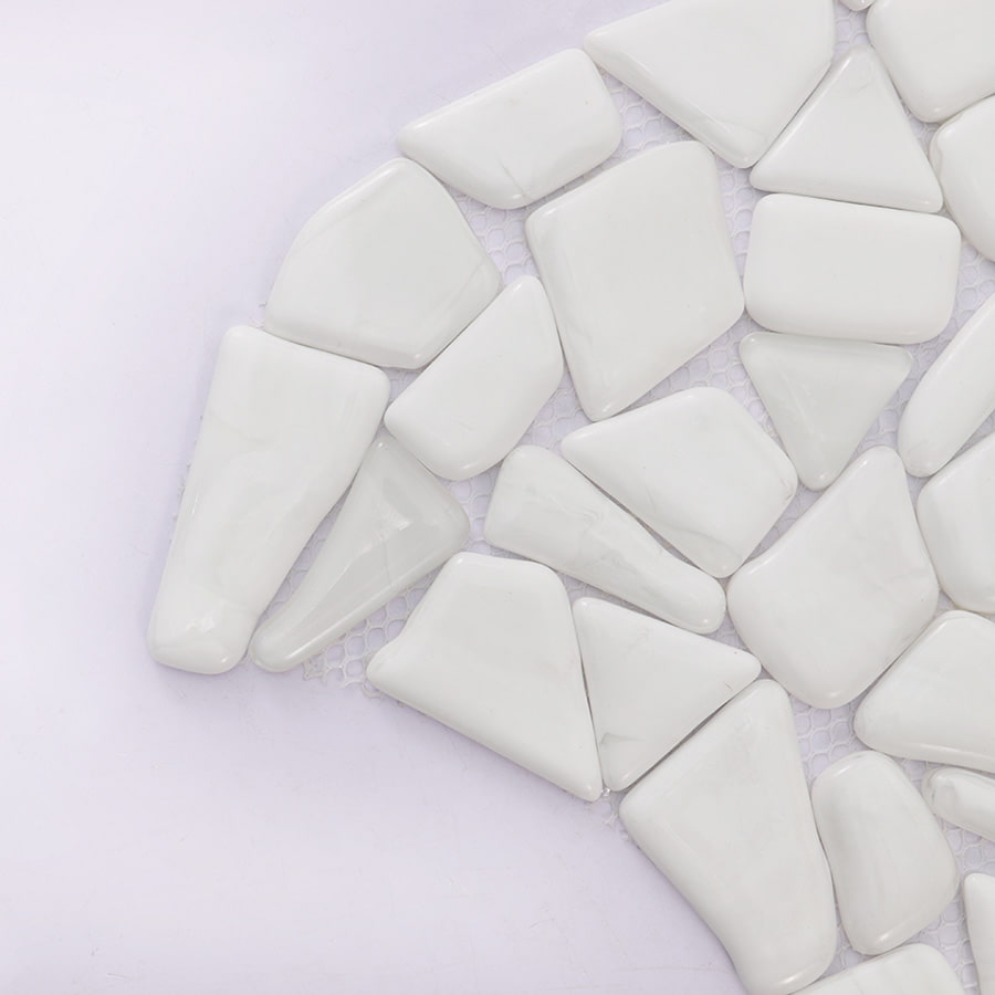 Close up detail of white pebble mosaic tile corner