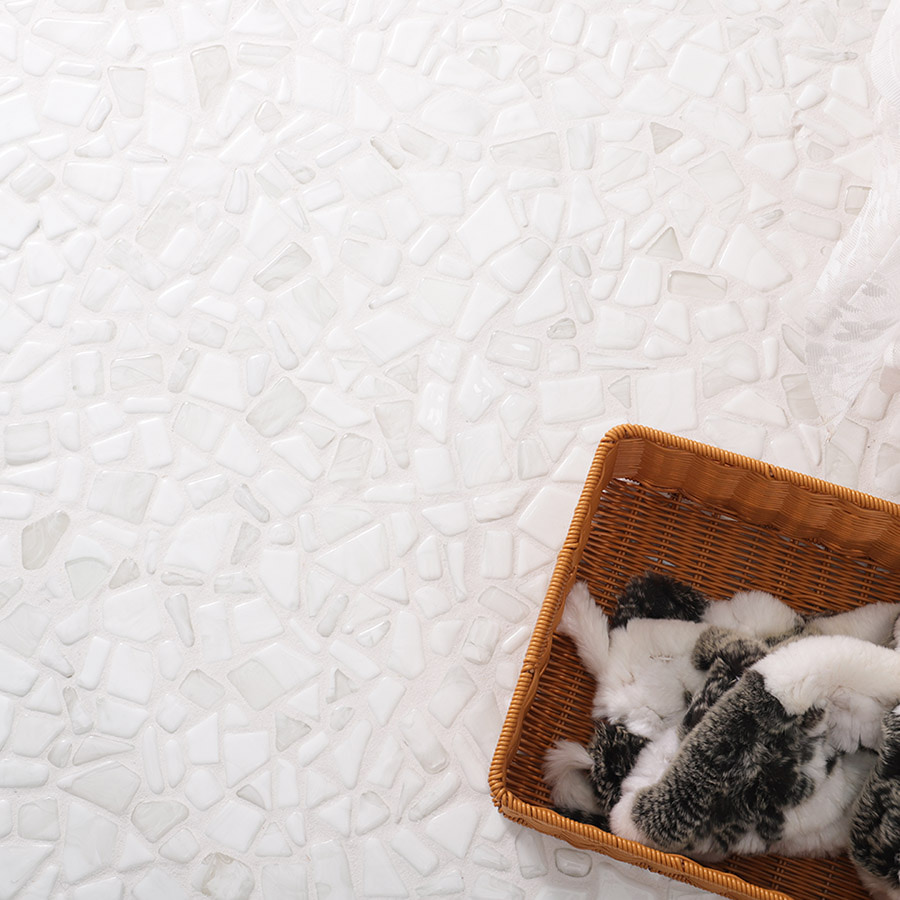 White pebble mosaic floor with wicker basket