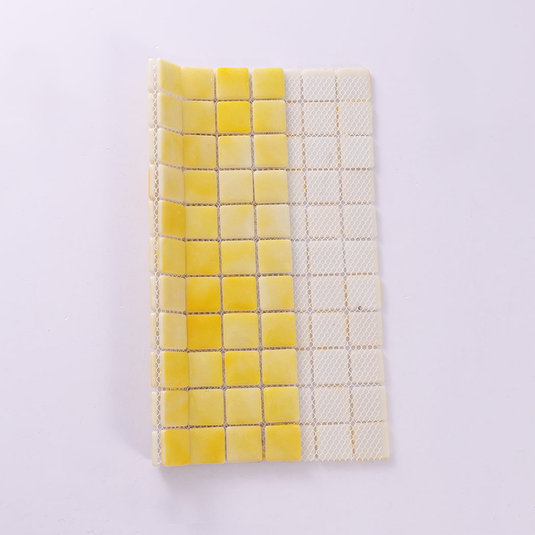 Backside view of yellow recycled glass mosaic tile sheet with mesh backing