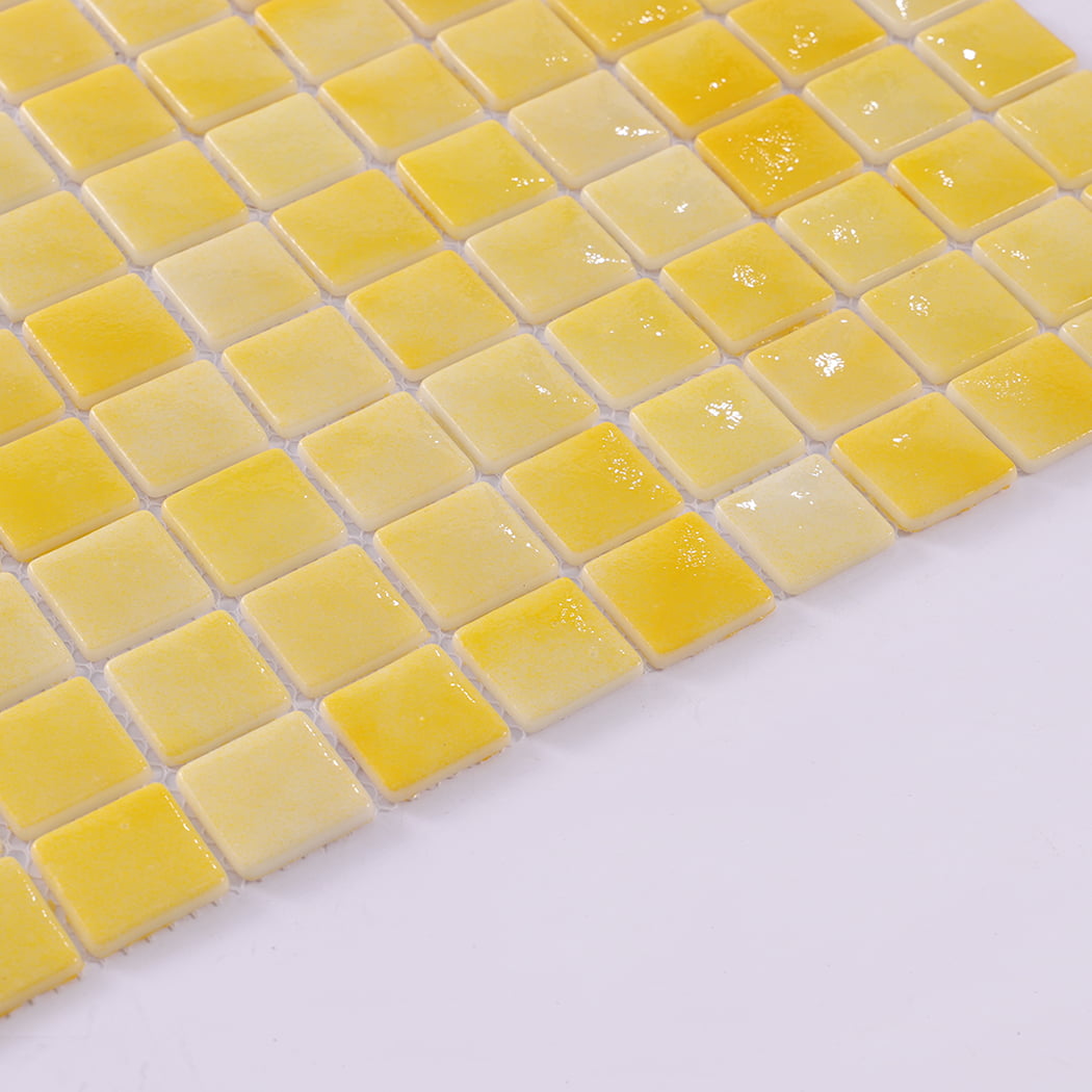 Close up of yellow recycled glass mosaic tiles with wet glossy surface