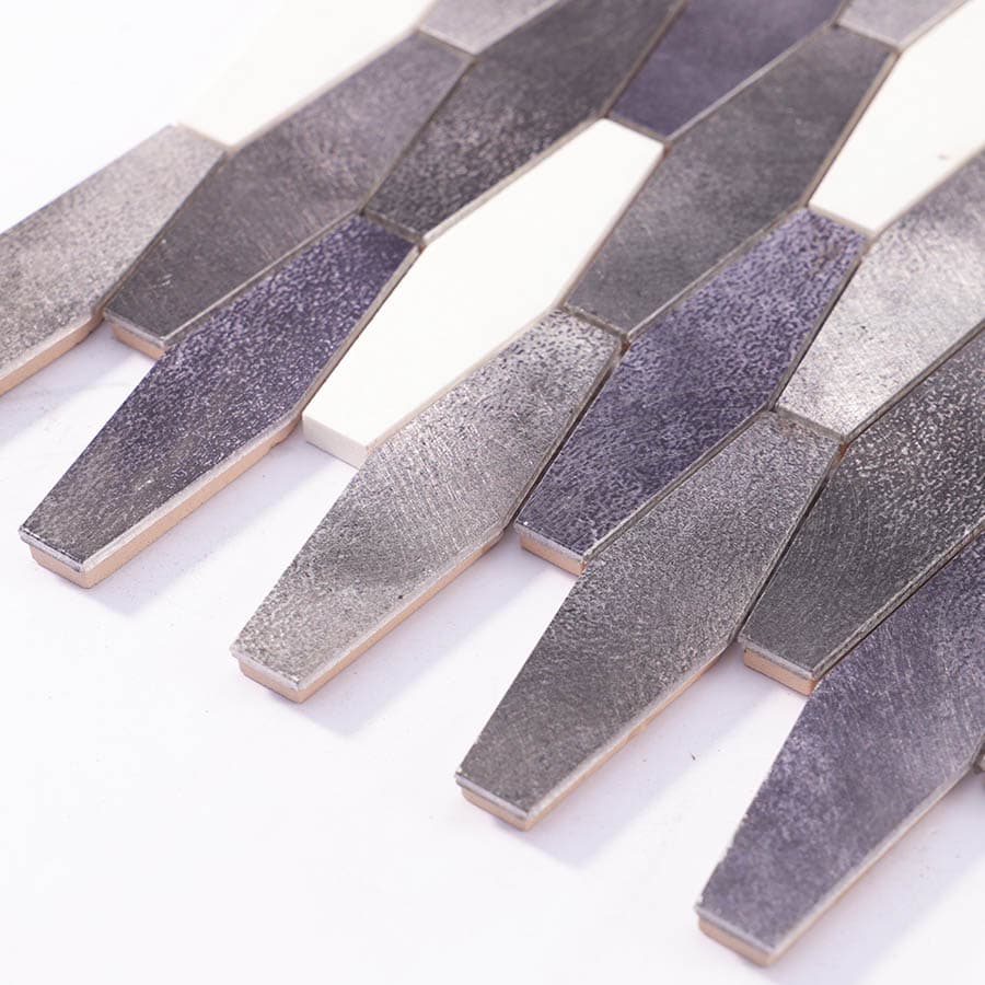Edge view of aluminum mosaic tiles showing layered thickness