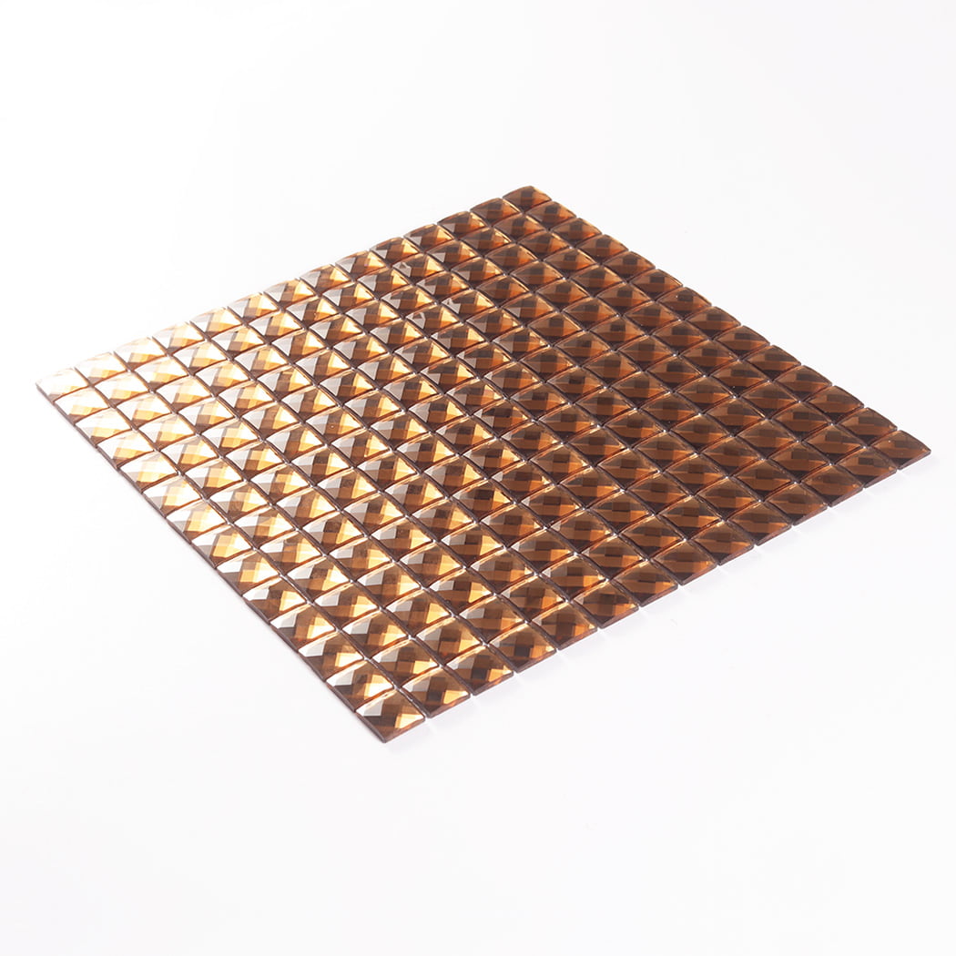 A full sheet of amber square glass mosaic tile viewed from a tilted angle.