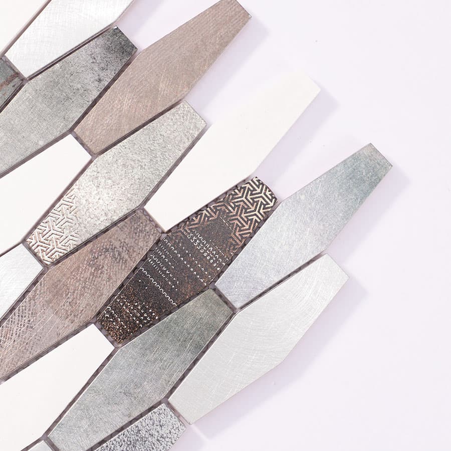 Angled close-up of aluminum mosaic tiles with fine patterns