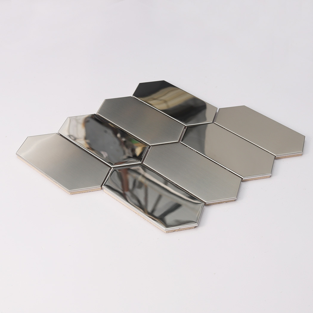 Angled view of a silver elongated hexagon metal mosaic tile sheet on a white surface.