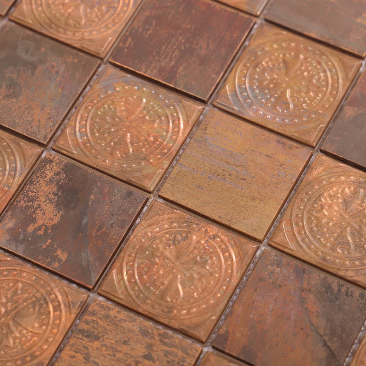 Detail of vintage copper mosaic tiles with embossed round design