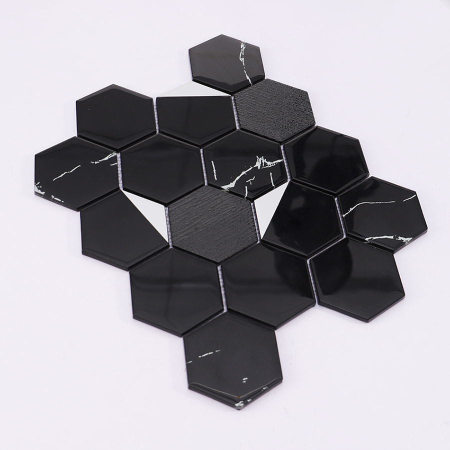 Angled view of black hexagon mosaic tile sheet showing depth and glossy surface