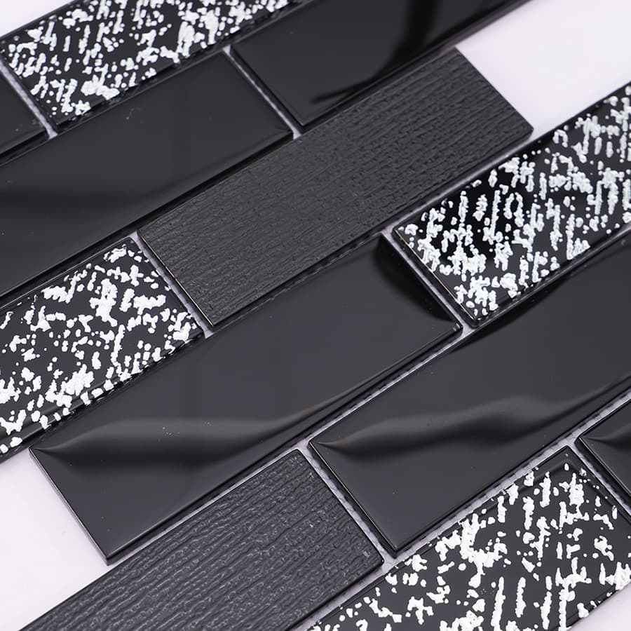 Angled view showing reflection and pattern of black silver subway mosaic tile