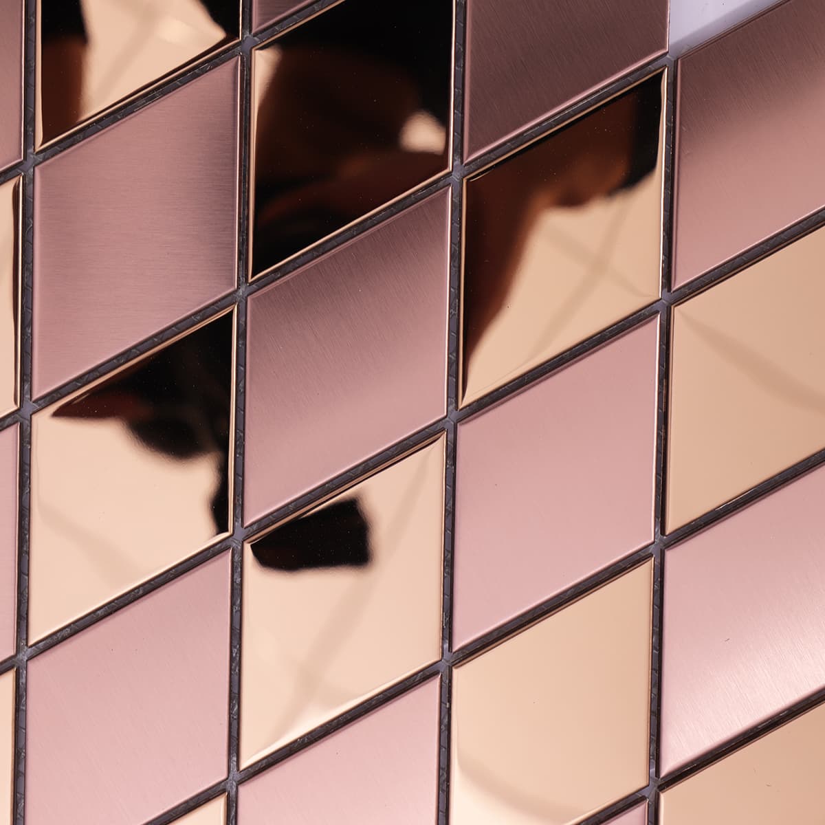 Close-up of brushed and mirror rose gold metal diamond mosaic