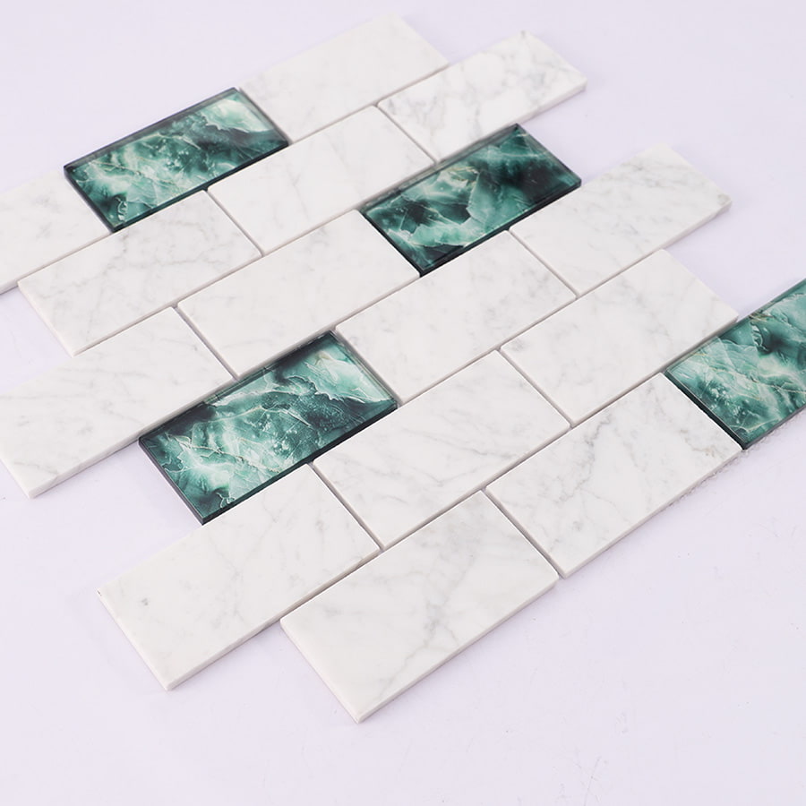 Angled view of white marble and green glass mosaic subway tile sheet