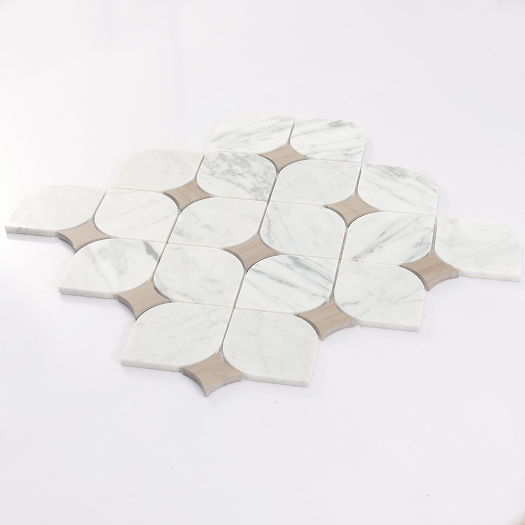 Angled view of white arabesque marble mosaic tile sheet with beige inserts