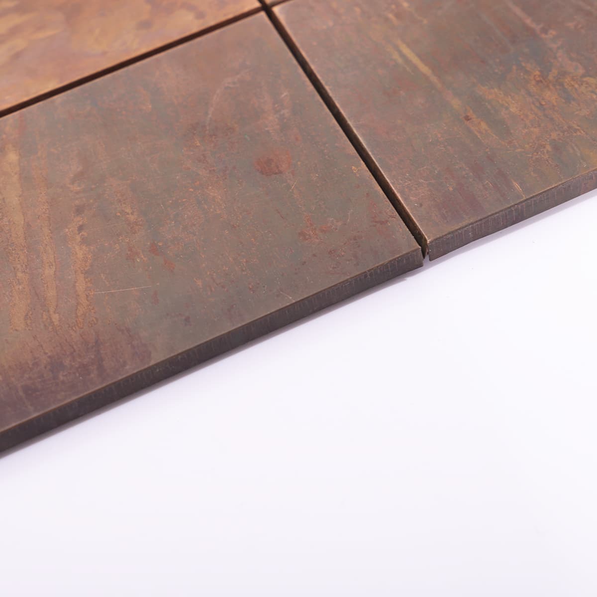 Edge view of rustic copper mosaic tile