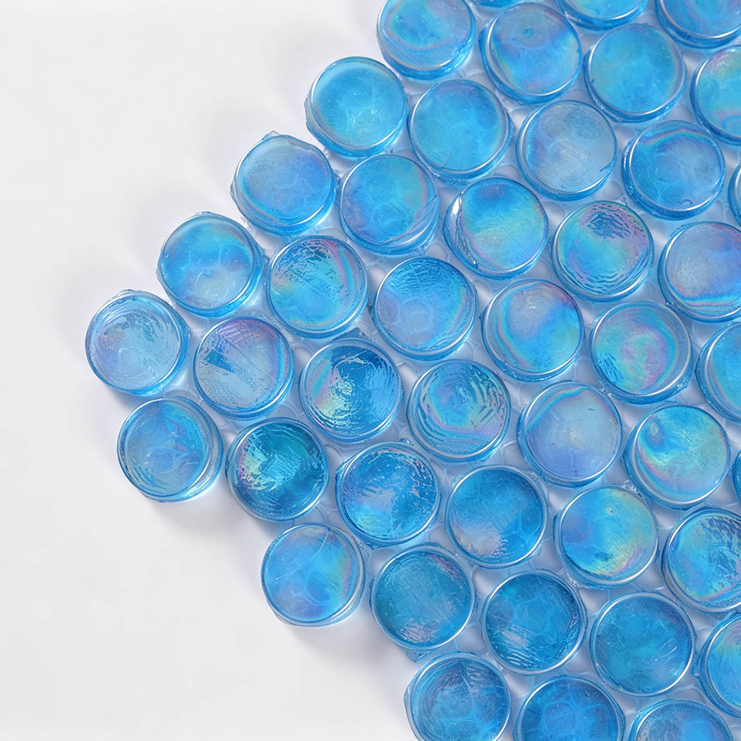Corner close-up of aqua blue iridescent round glass mosaic tiles