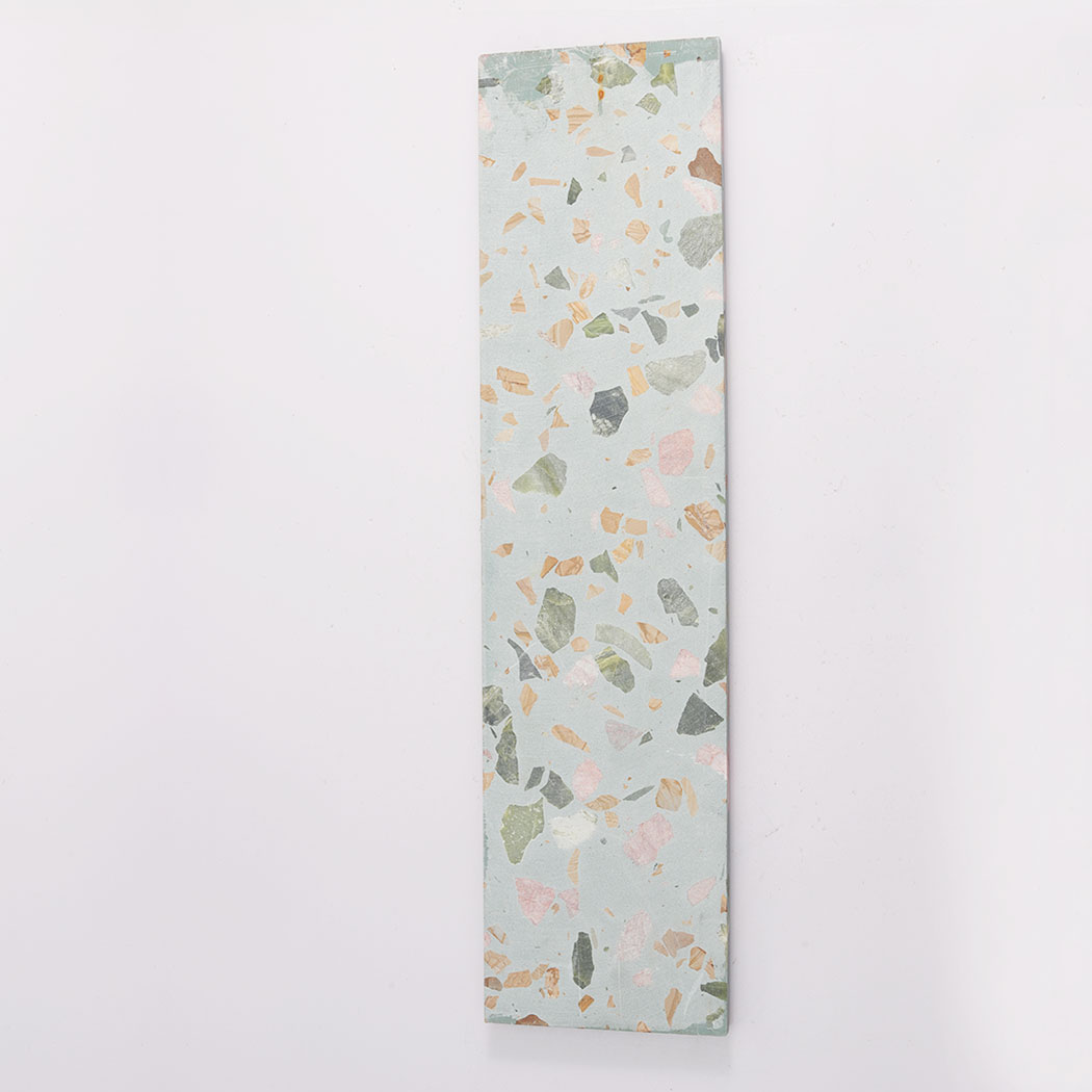 Back view of aqua terrazzo fluted tile with flat terrazzo surface