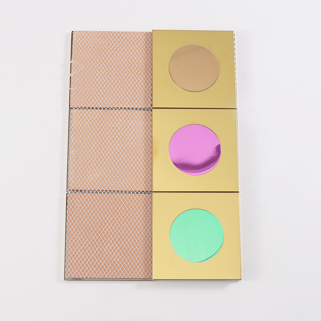 Three gold tiles shown from the front alongside three tiles showing the mesh backing.