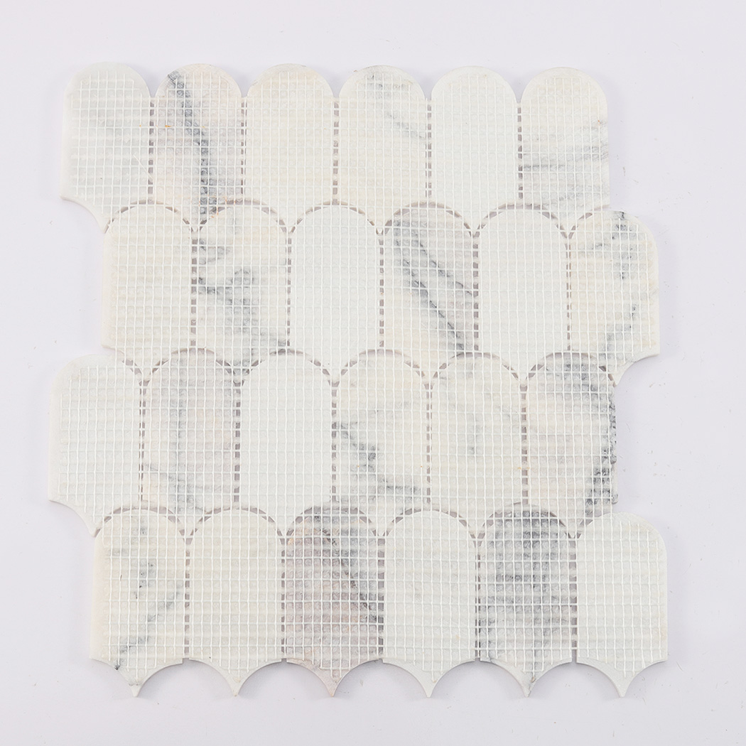 Back view of white arched marble mosaic tile sheet with fiber mesh backing