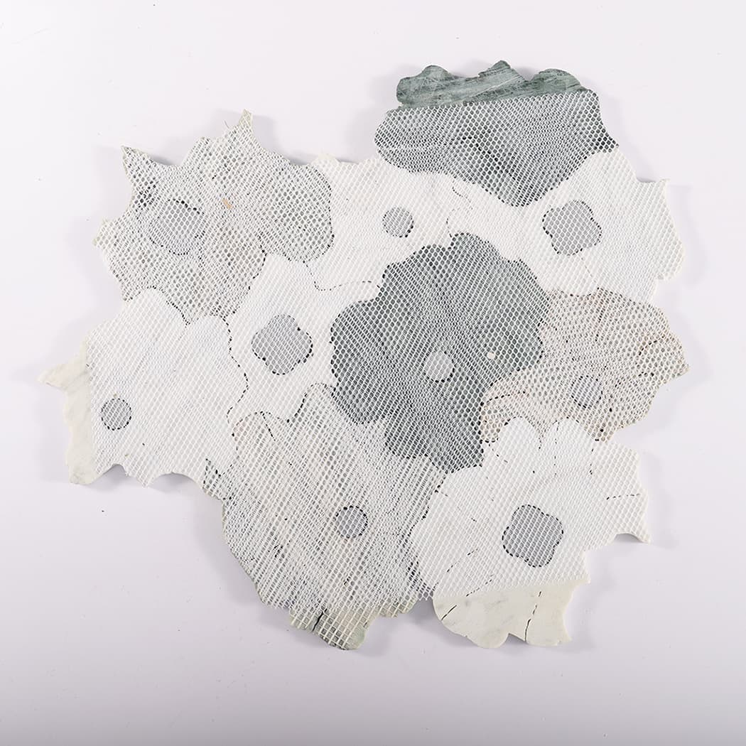 Back view of mesh-mounted green and white flower mosaic tile sheet.