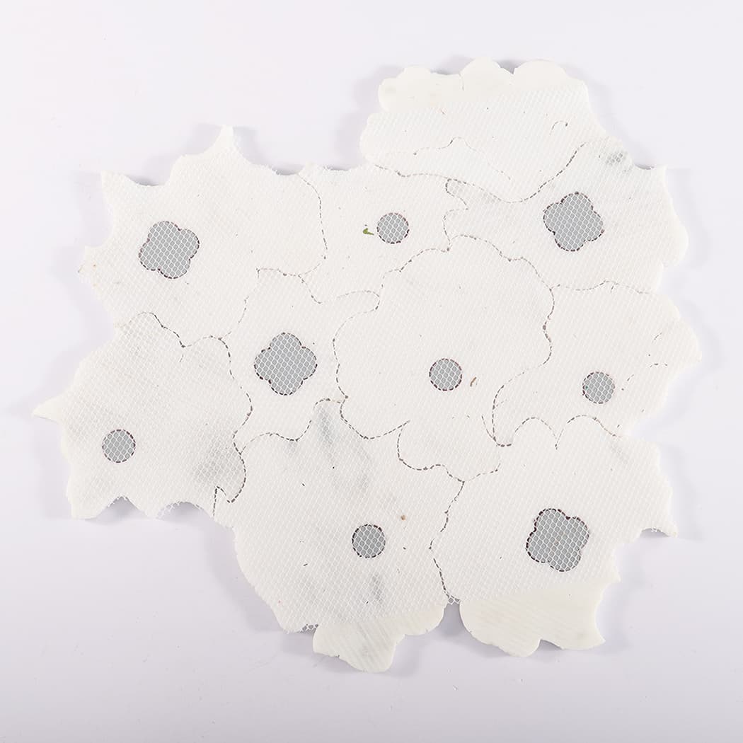 Back view of mesh-mounted flower marble mosaic tile sheet.