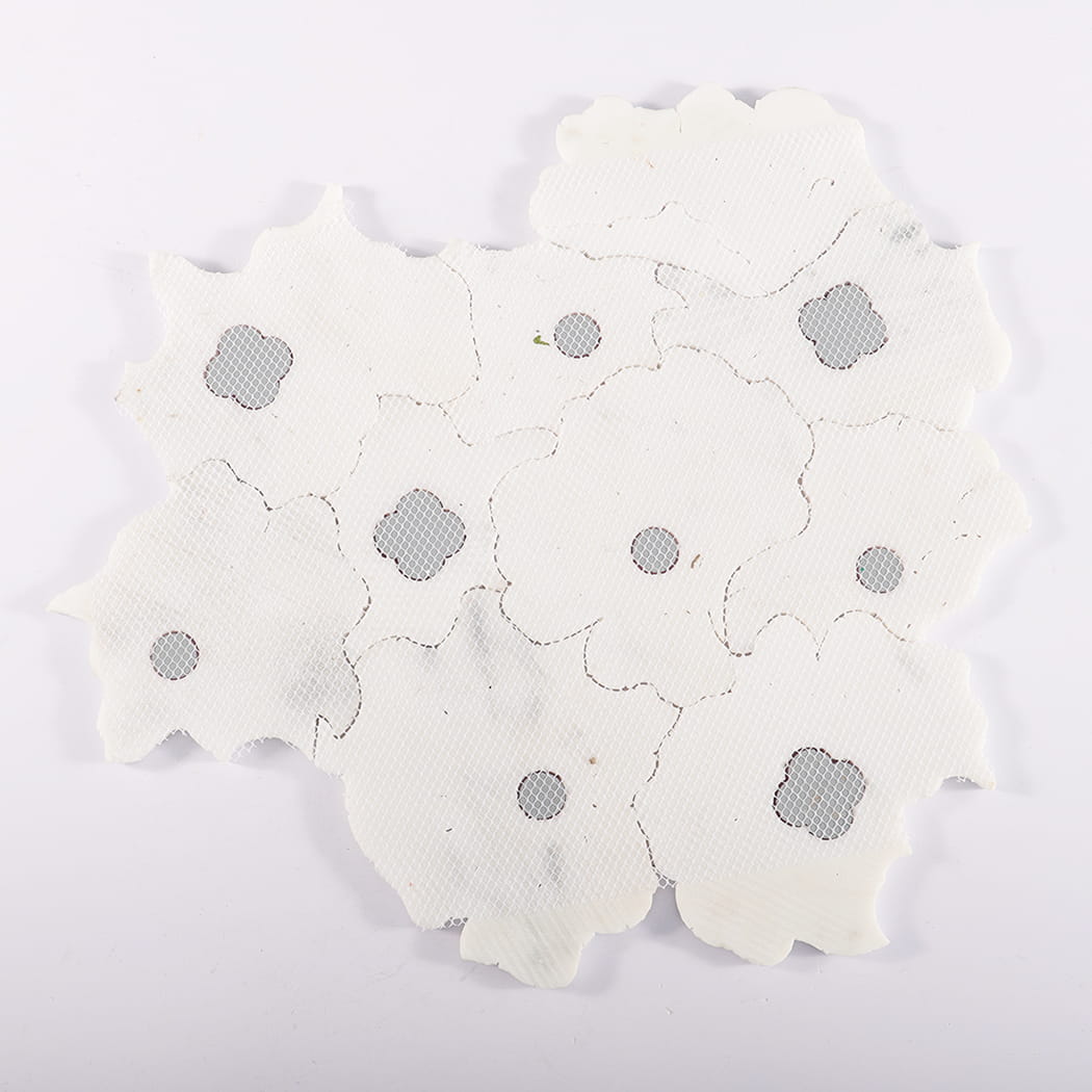 Back view of mesh-mounted flower marble mosaic tile sheet.