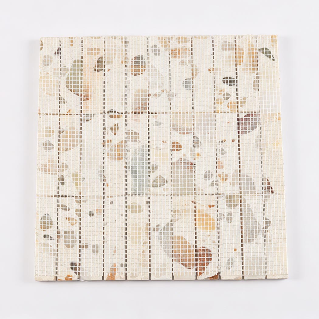 Back view of terrazzo mosaic tile sheet showing mesh backing for easy installation