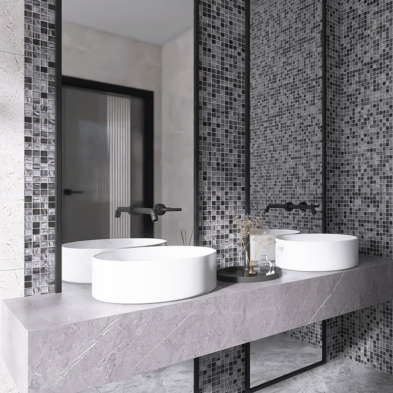 Grey mosaic tile wall with dual round sinks and stone vanity top