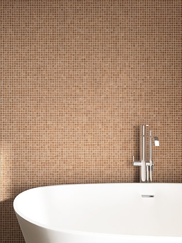 Elegant light brown mosaic tile wall behind freestanding bathtub