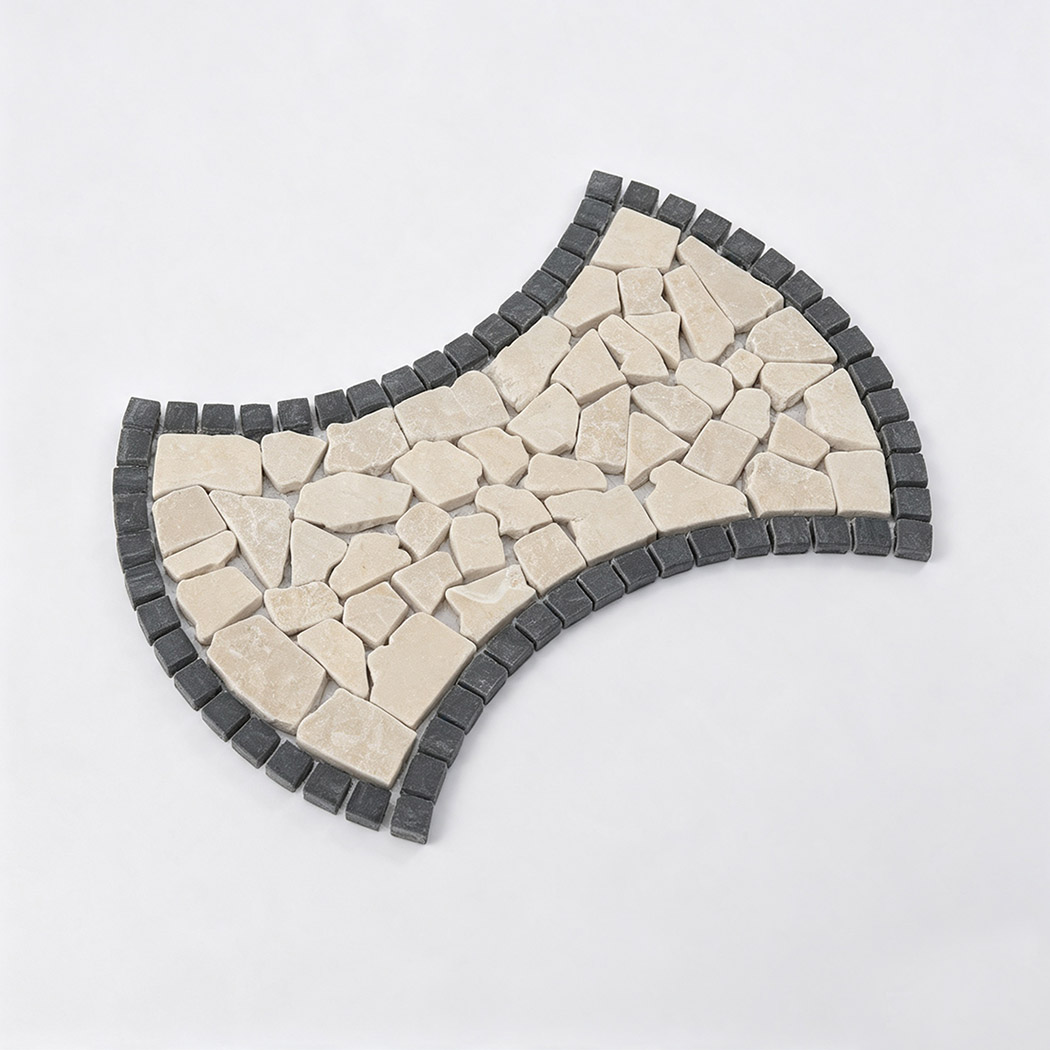 Angled view of bow tie shaped beige marble pebble mosaic with charcoal border