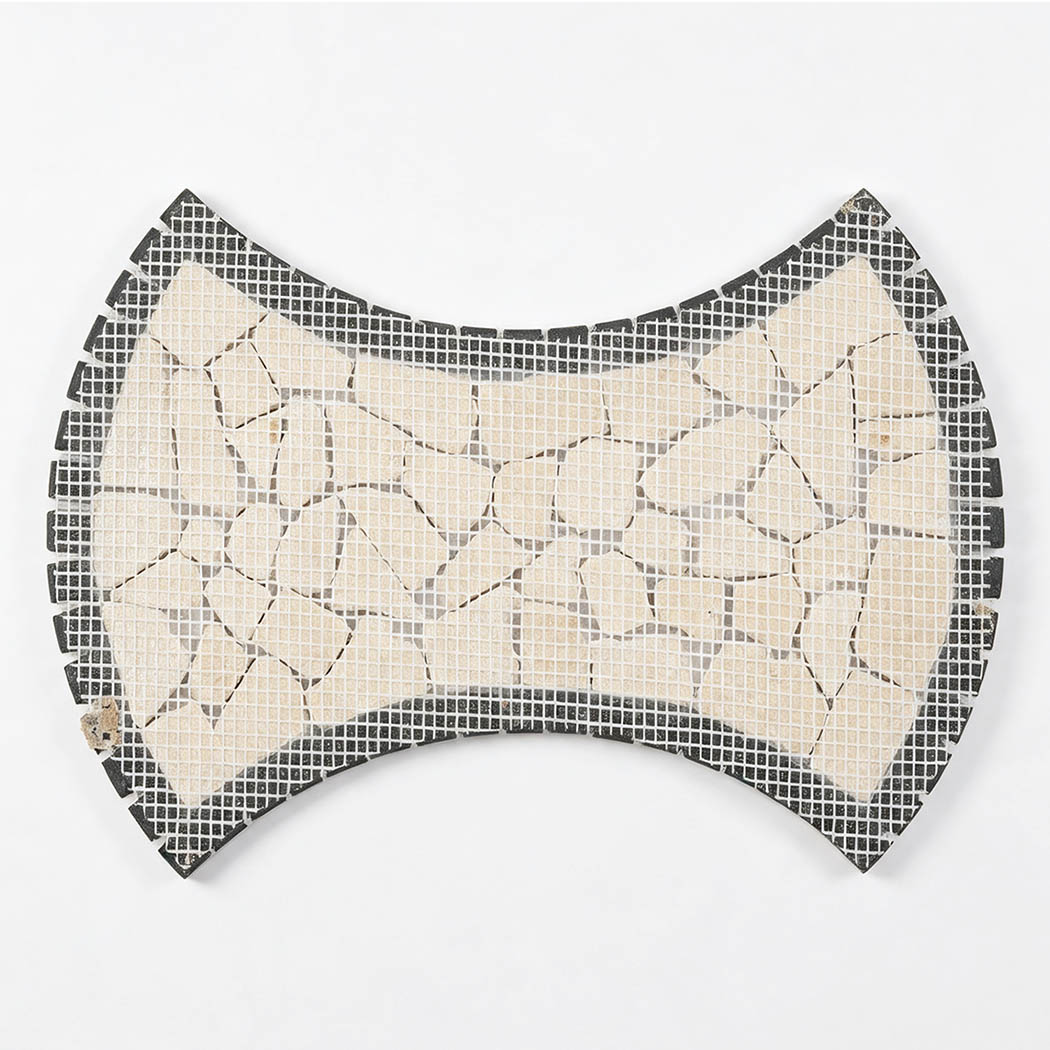 Mesh-backed reverse side of beige marble pebble mosaic tile with dark border