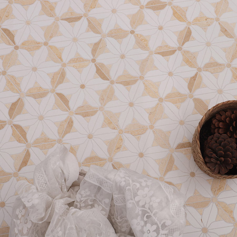 Top view of floral mosaic tile with lace fabric