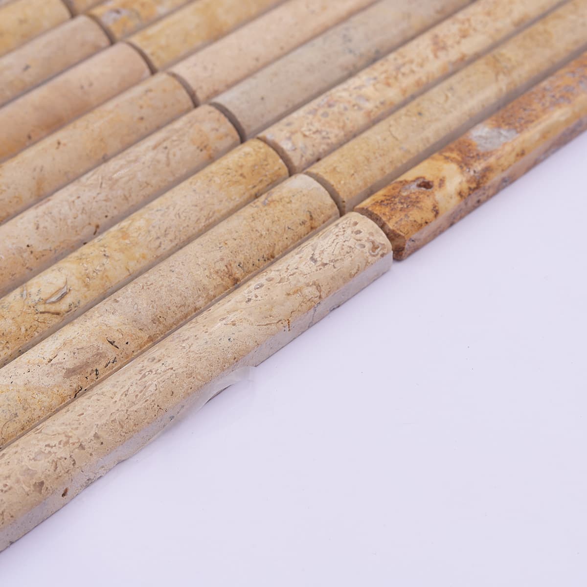 Side view showing thickness of beige fluted travertine strips