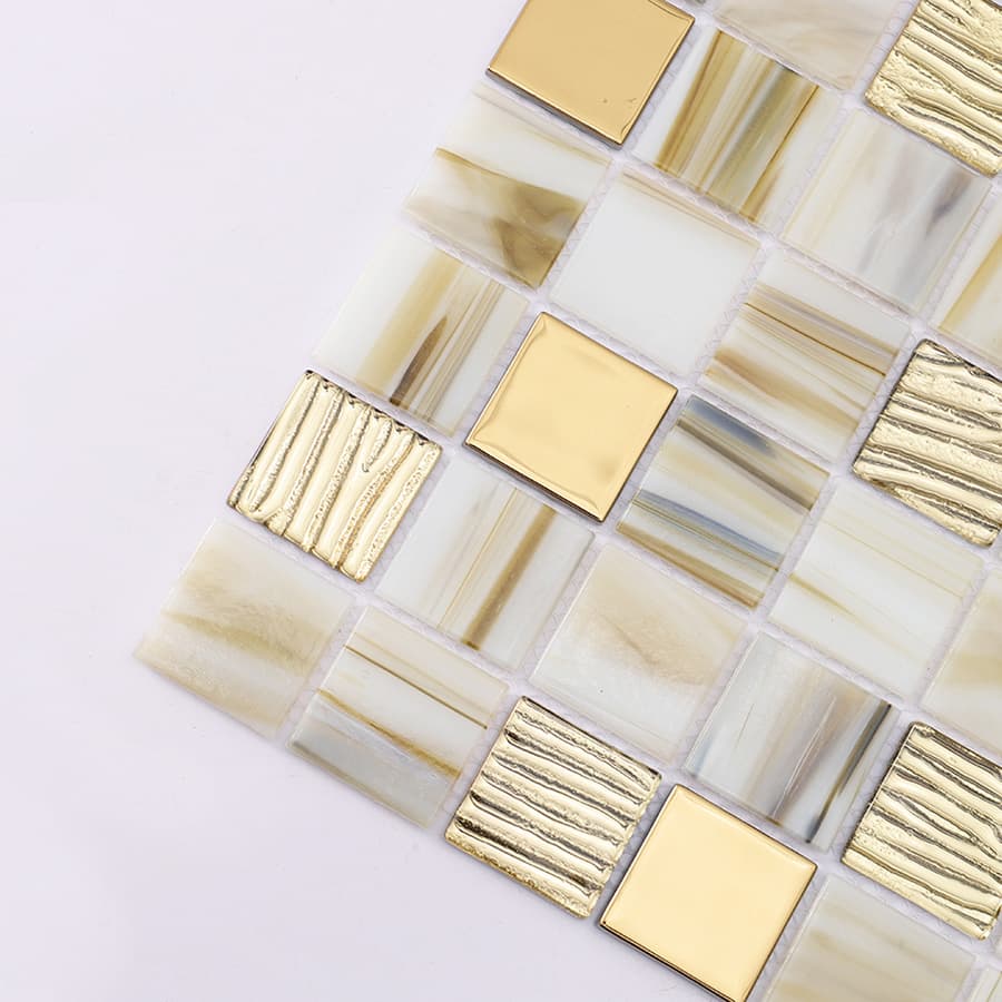 Close up of beige mosaic tile corner with gold metallic square