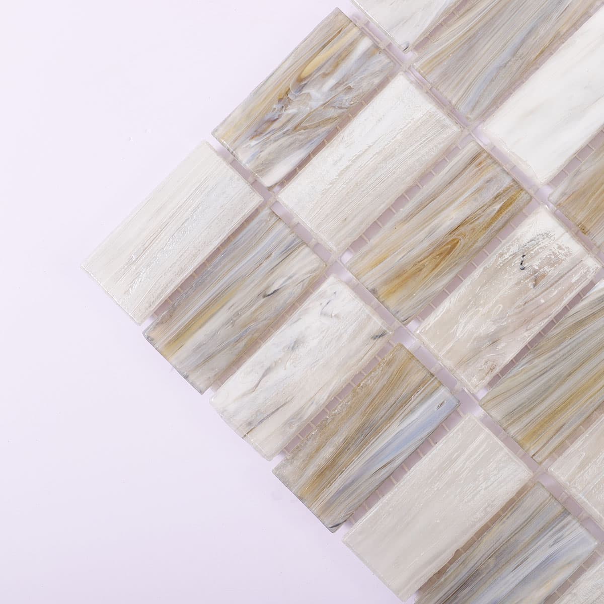 Corner detail of beige and gray rectangular checkered glass mosaic tile